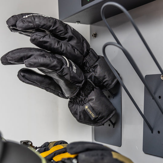 Close up of a pair of gloves drying on the Koralp Snow Glove & Helmet Dryer